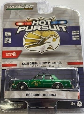 GREEN42970-CVERT - DODGE Diplomat 1988 Green Patrol of Califonia HOT PURSUIT serie 39 in blister - 1