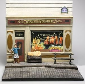 AKI0128 - Diorama bakkerijfront met stoep en figuur afmeting H14 cm x B 15 cm x D14 cm